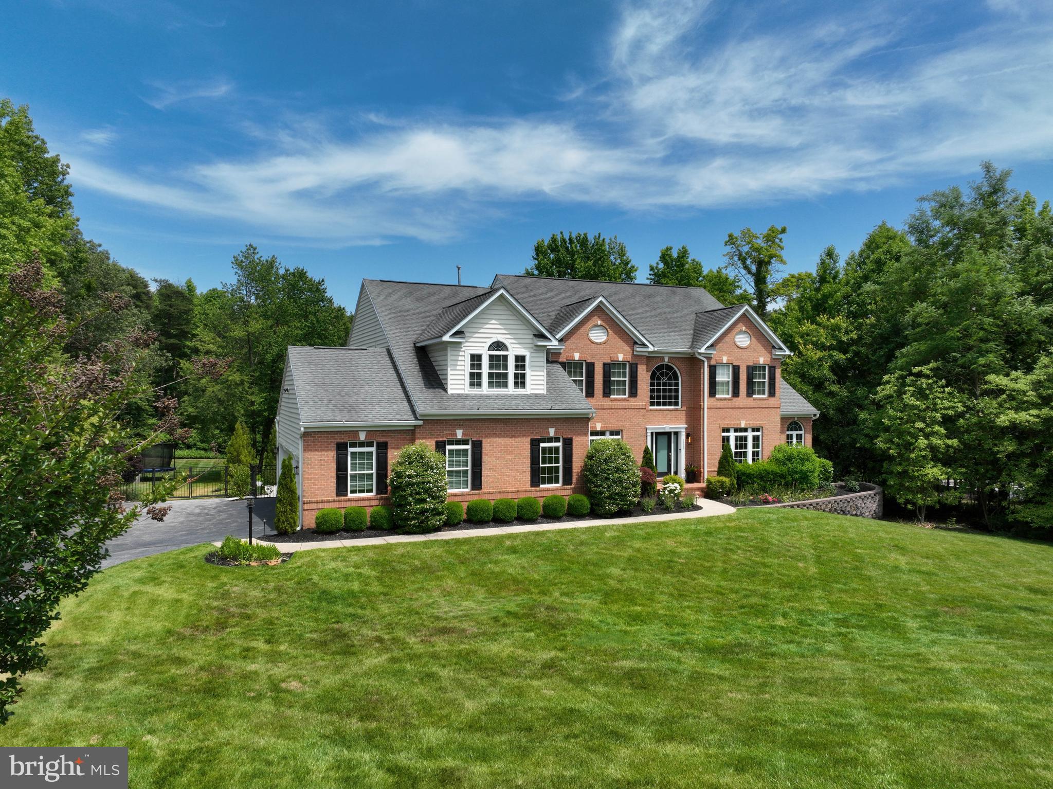 1613 Braid Hills Drive Pasadena, MD 21122 - Photo 128 of 148 a front view of a house with a garden