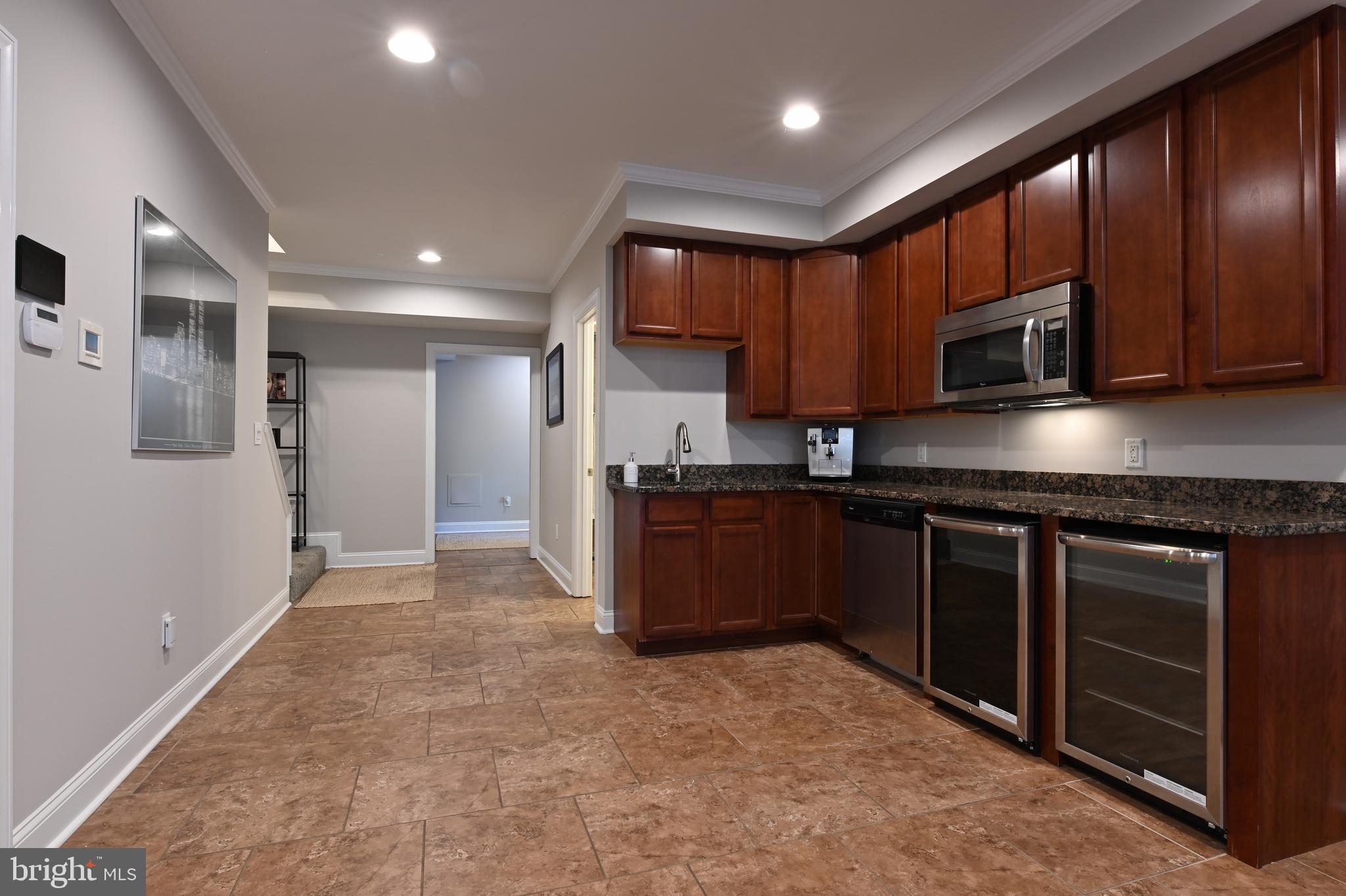 1613 Braid Hills Drive Pasadena, MD 21122 - Photo 134 of 148 a kitchen with stainless steel appliances granite countertop wooden cabinets a stove top oven a sink and dishwasher
