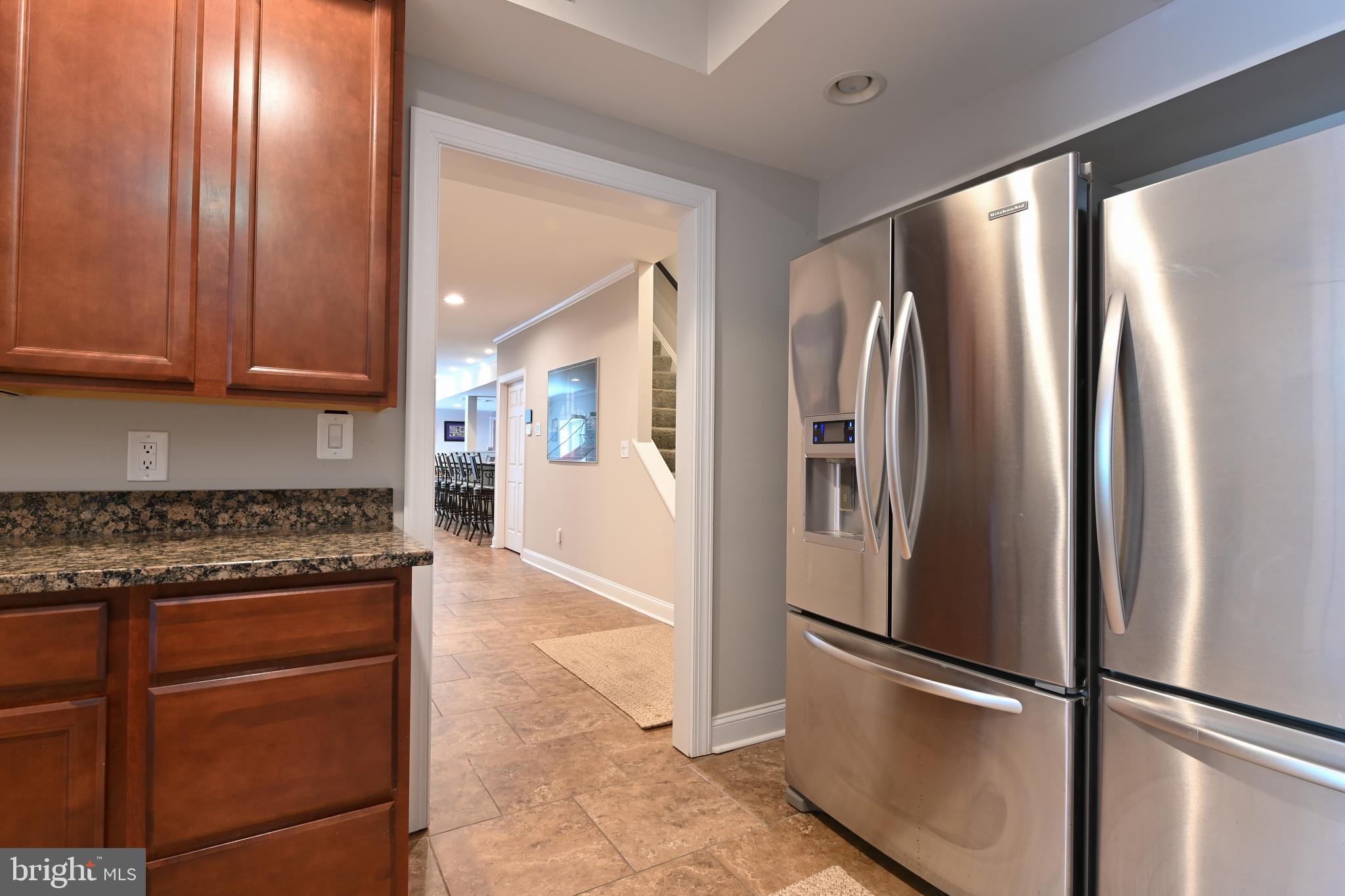 1613 Braid Hills Drive Pasadena, MD 21122 - Photo 137 of 148 a kitchen with stainless steel appliances granite countertop a refrigerator and a stove top oven