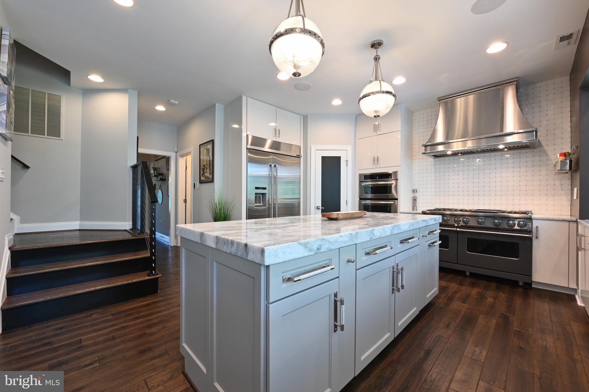 1613 Braid Hills Drive Pasadena, MD 21122 - Photo 20 of 148 a kitchen with stainless steel appliances granite countertop a stove and cabinets