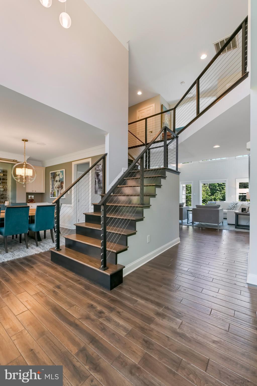 1613 Braid Hills Drive Pasadena, MD 21122 - Photo 3 of 148 a view of entryway and hall with wooden floor