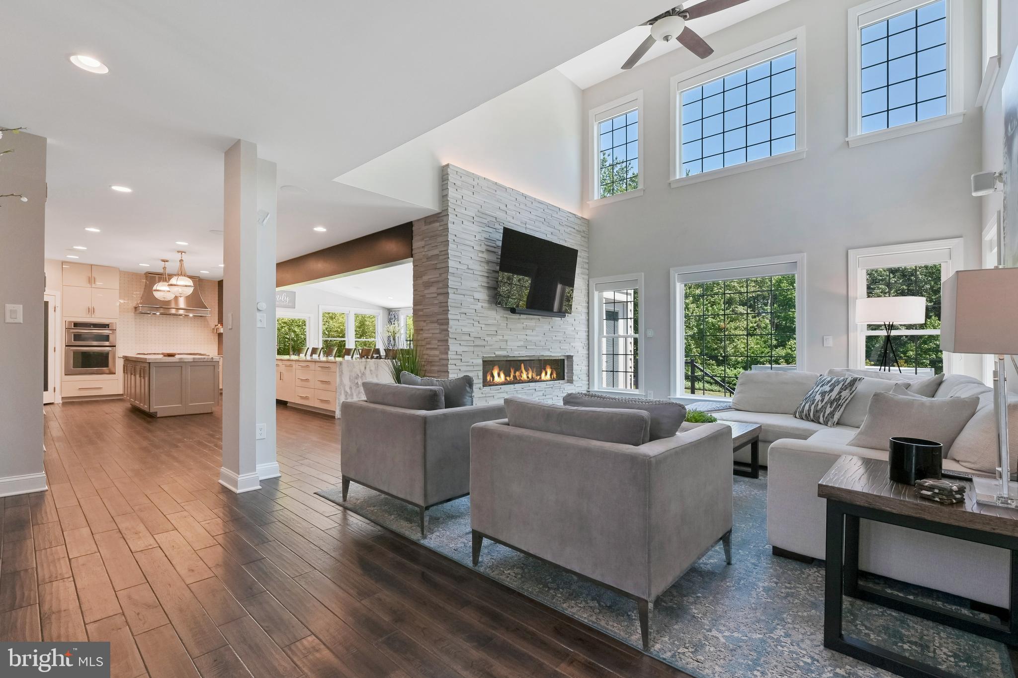 1613 Braid Hills Drive Pasadena, MD 21122 - Photo 37 of 148 a living room with furniture and a flat screen tv