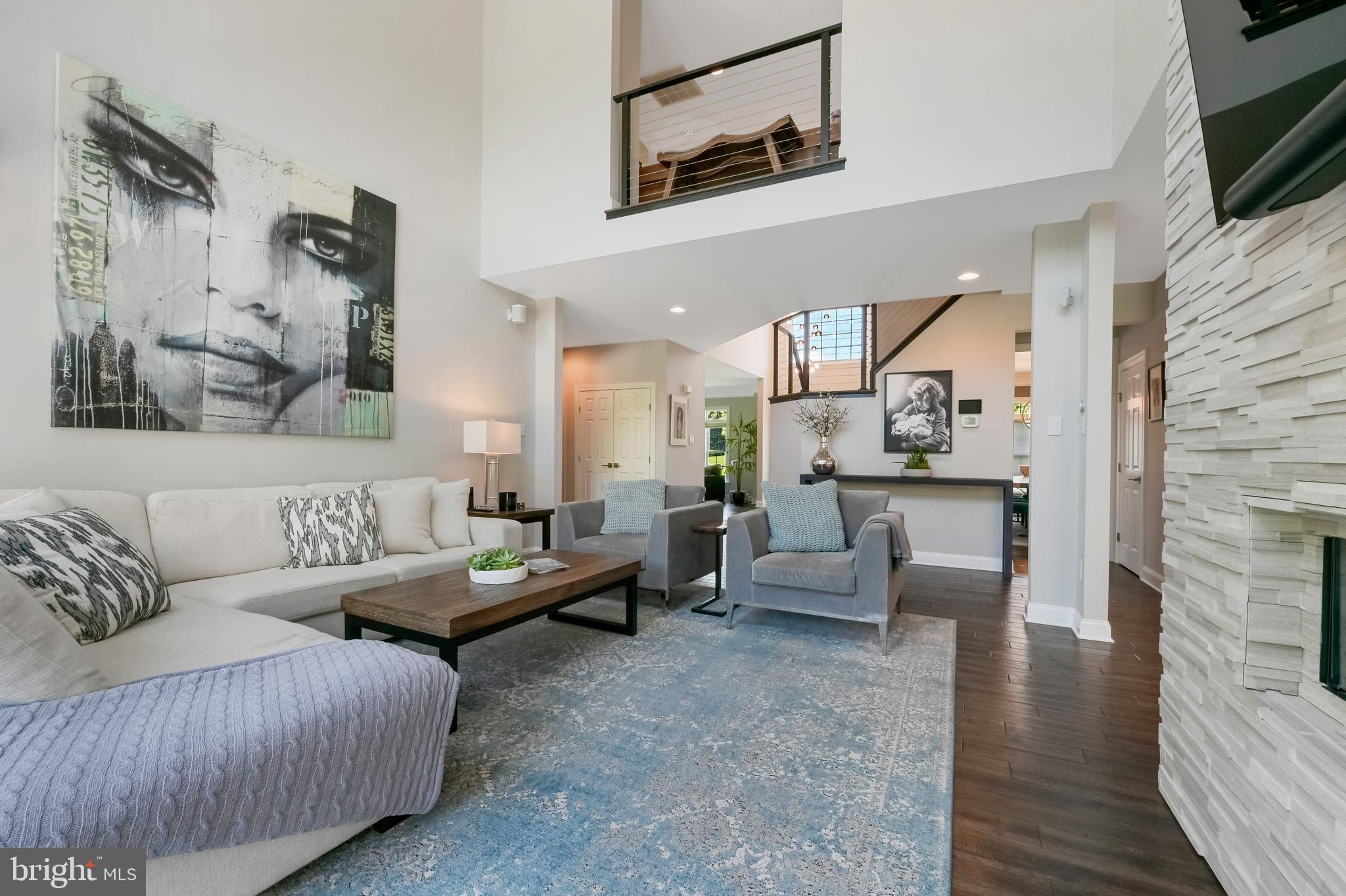 1613 Braid Hills Drive Pasadena, MD 21122 - Photo 39 of 148 a living room with furniture and a fireplace