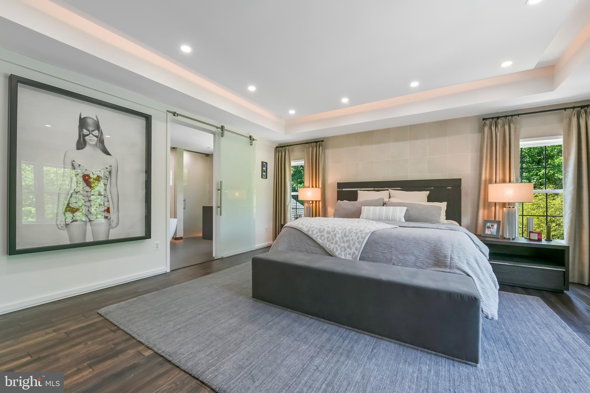 1613 Braid Hills Drive Pasadena, MD 21122 - Photo 53 of 148 a bedroom with a large bed and a painting on the wall