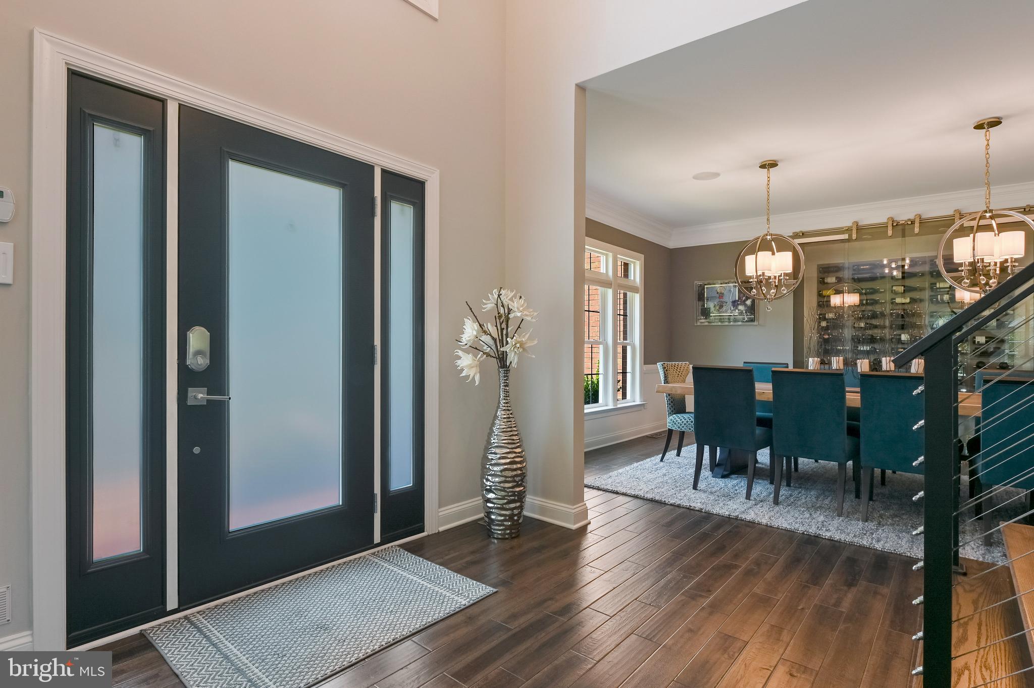 1613 Braid Hills Drive Pasadena, MD 21122 - Photo 7 of 148 a view of a dining room with furniture and wooden floor
