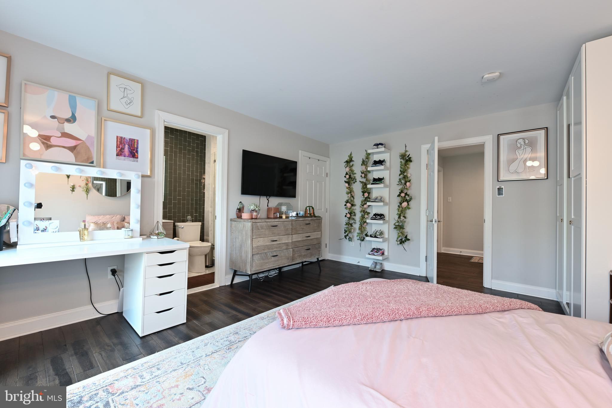 1613 Braid Hills Drive Pasadena, MD 21122 - Photo 71 of 148 a bedroom with a bed and a flat screen tv