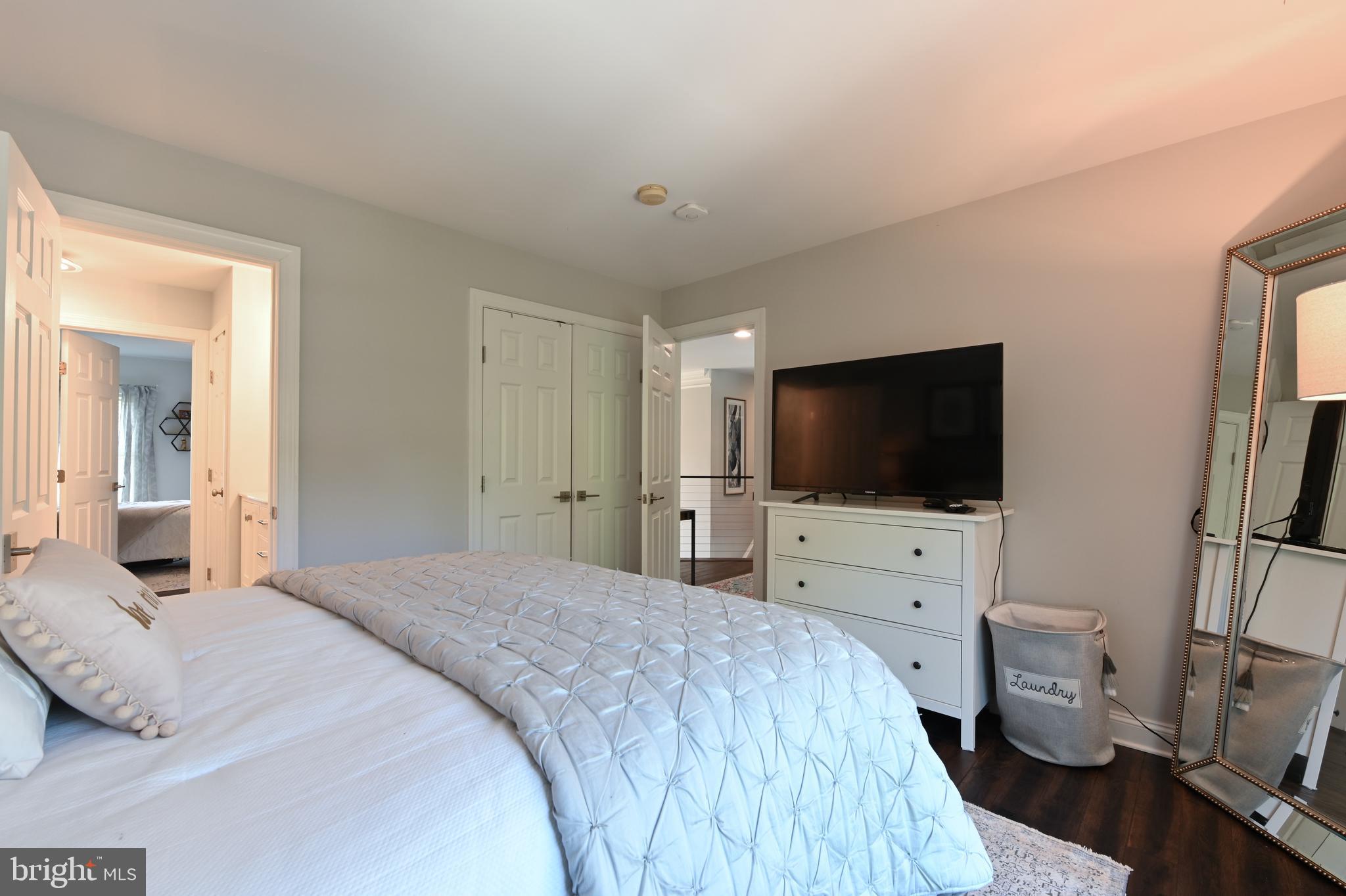 1613 Braid Hills Drive Pasadena, MD 21122 - Photo 72 of 148 a bedroom with a bed and a flat screen tv