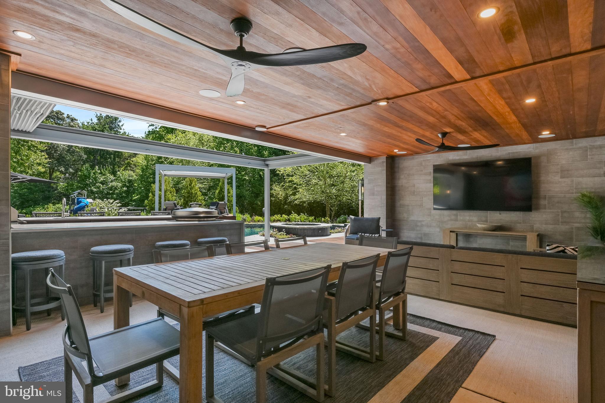 1613 Braid Hills Drive Pasadena, MD 21122 - Photo 81 of 148 a view of a patio with table and chairs and potted plants