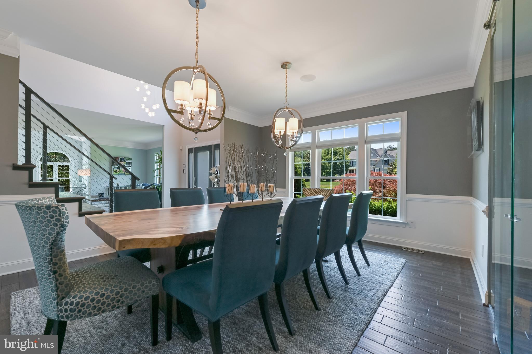 1613 Braid Hills Drive Pasadena, MD 21122 - Photo 10 of 148 a view of a dining room with furniture a chandelier and wooden floor