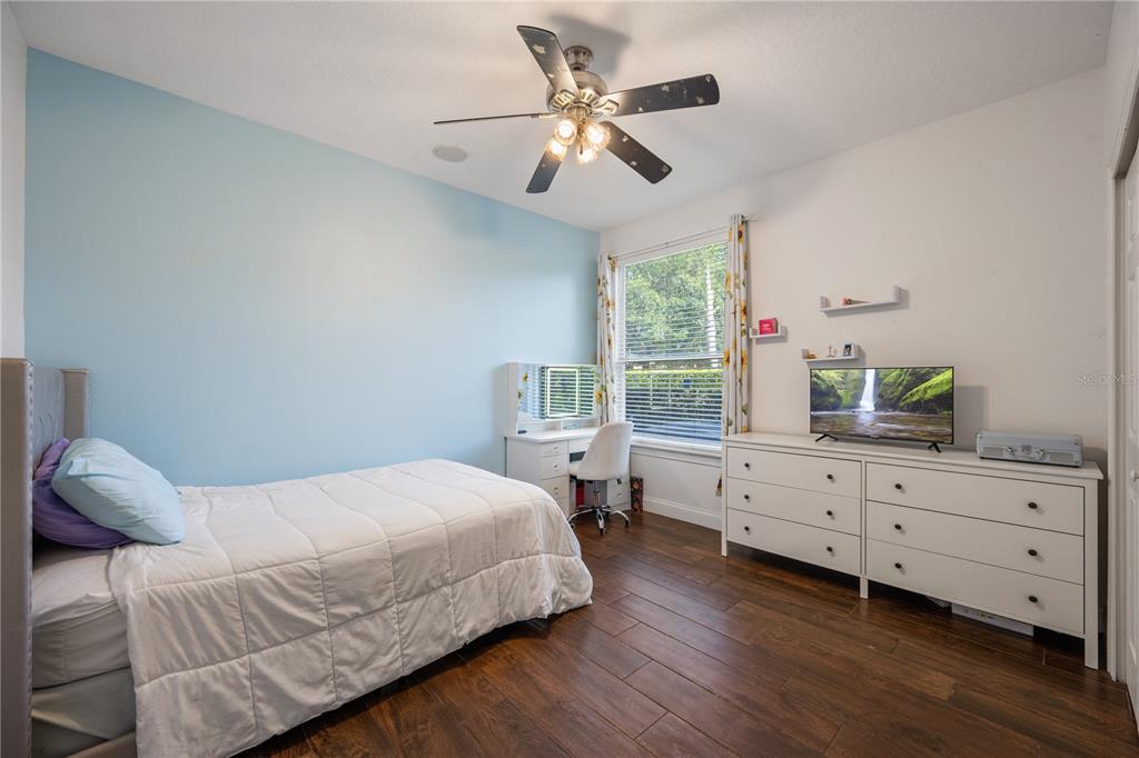 2002 Water Key Drive Windermere, FL 34786 - Photo 23 of 60 a bedroom with a bed and a dresser