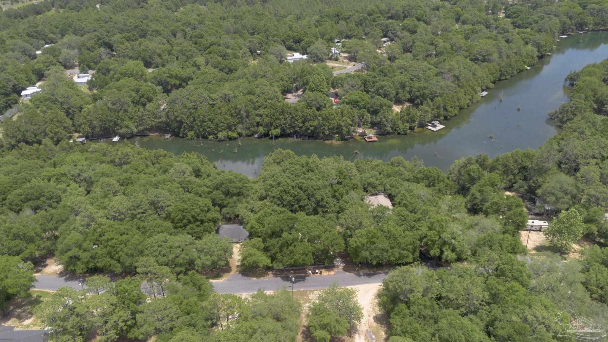 10290 West Lake Road Milton, FL 32583 - Photo 49 of 53 an aerial view of residential house with outdoor space and trees all around