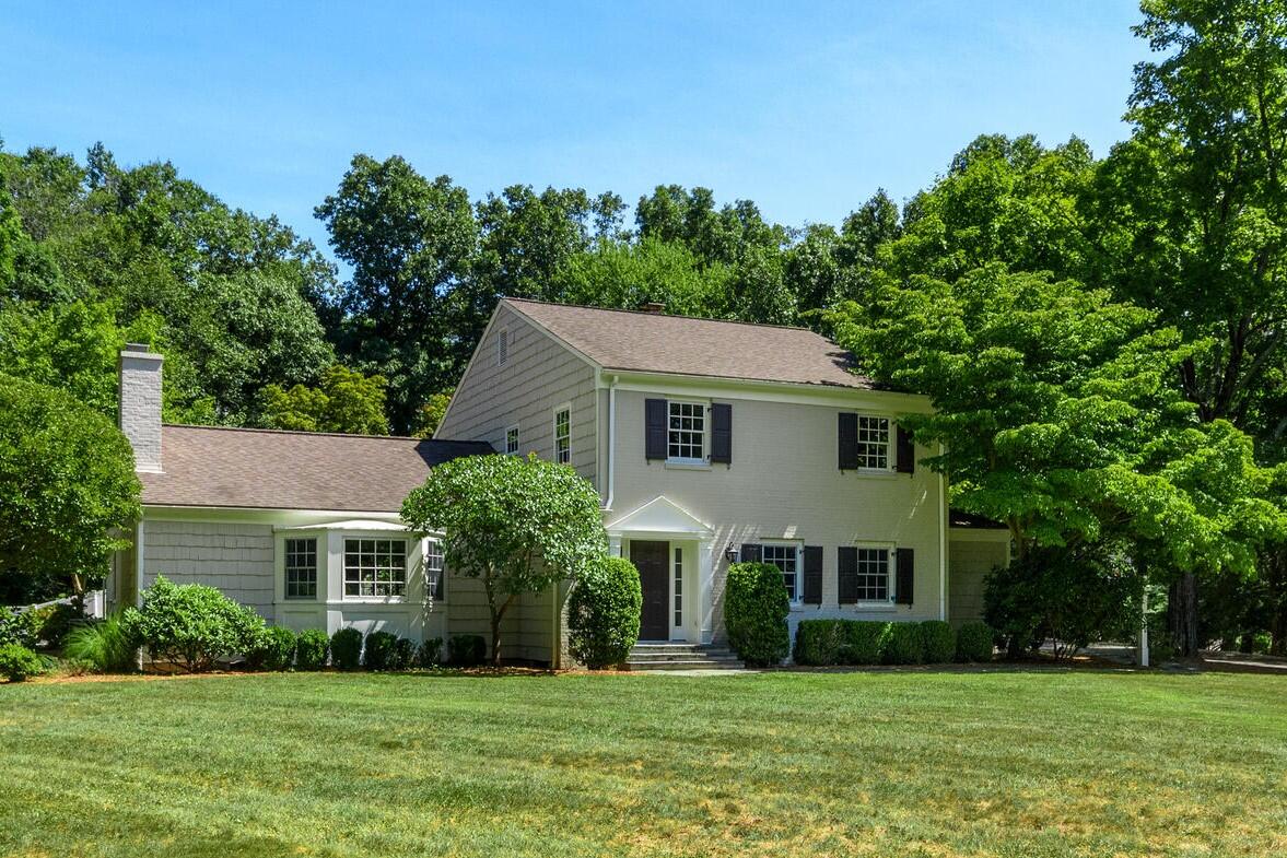 9 Old Parish Road Darien, CT 06820 - Photo 2 of 49 a aerial view of a white house in front of a big yard with large trees