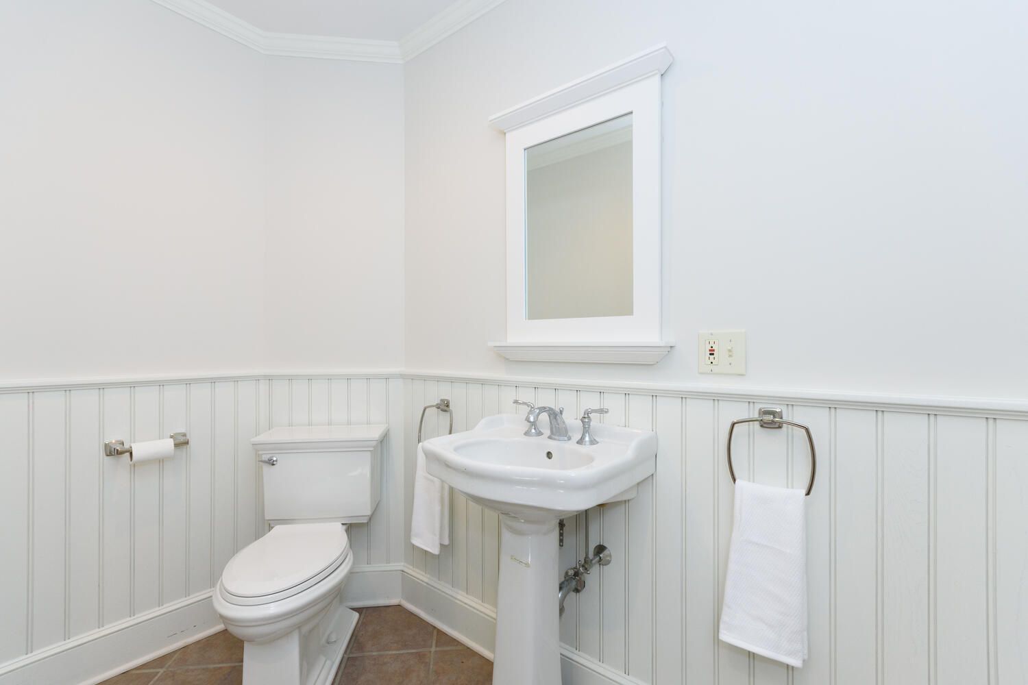9 Old Parish Road Darien, CT 06820 - Photo 29 of 49 a bathroom with a toilet sink and mirror