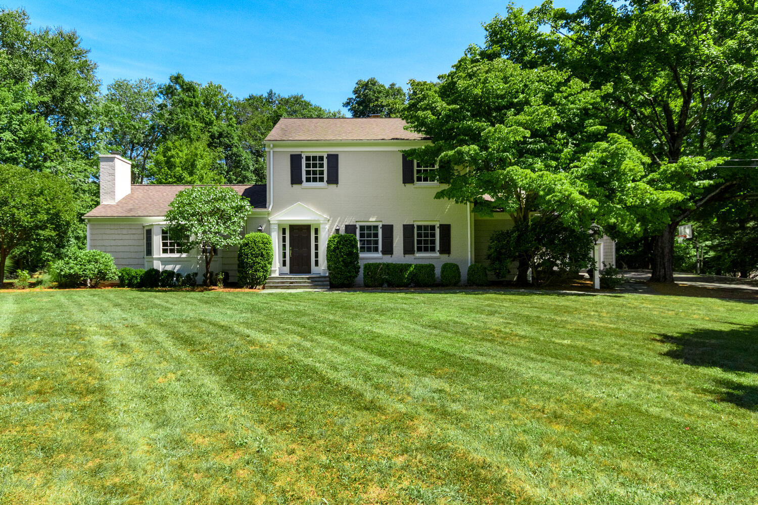 9 Old Parish Road Darien, CT 06820 - Photo 3 of 49 a front view of a house with a yard