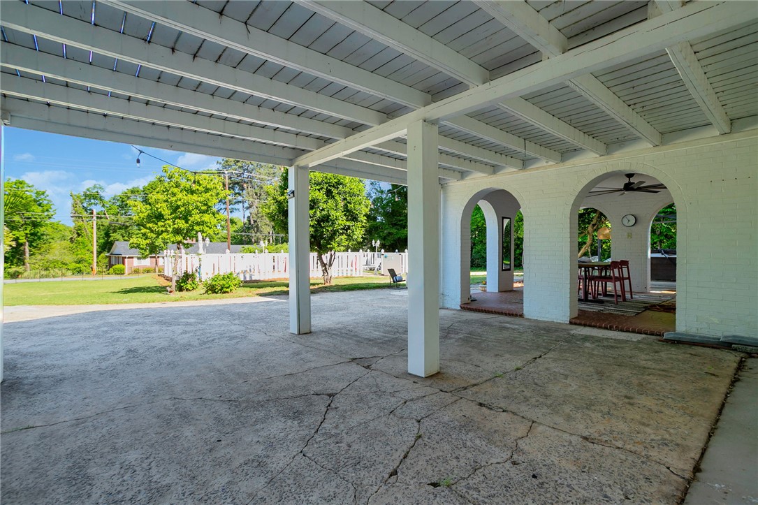 1107 Springdale Road Anderson, SC 29621 - Photo 37 of 49 Enjoy outdoor living with this expansive covered patio, featuring graceful arches and a serene backyard.