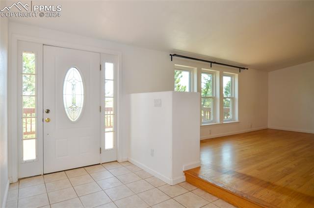 34115 Big Springs Road Yoder, CO 80864 - Photo 5 of 35 Foyer with light tile flooring