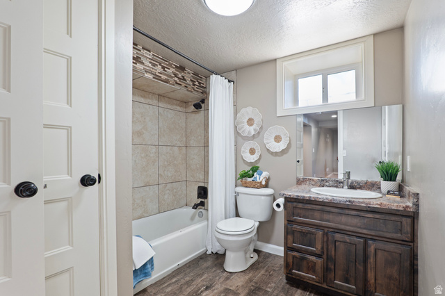 115 East 1600th Street North Santaquin, UT 84655 - Photo 25 of 52 Bathroom featuring a wood-finish vanity with an integrated sink and stone-look countertop