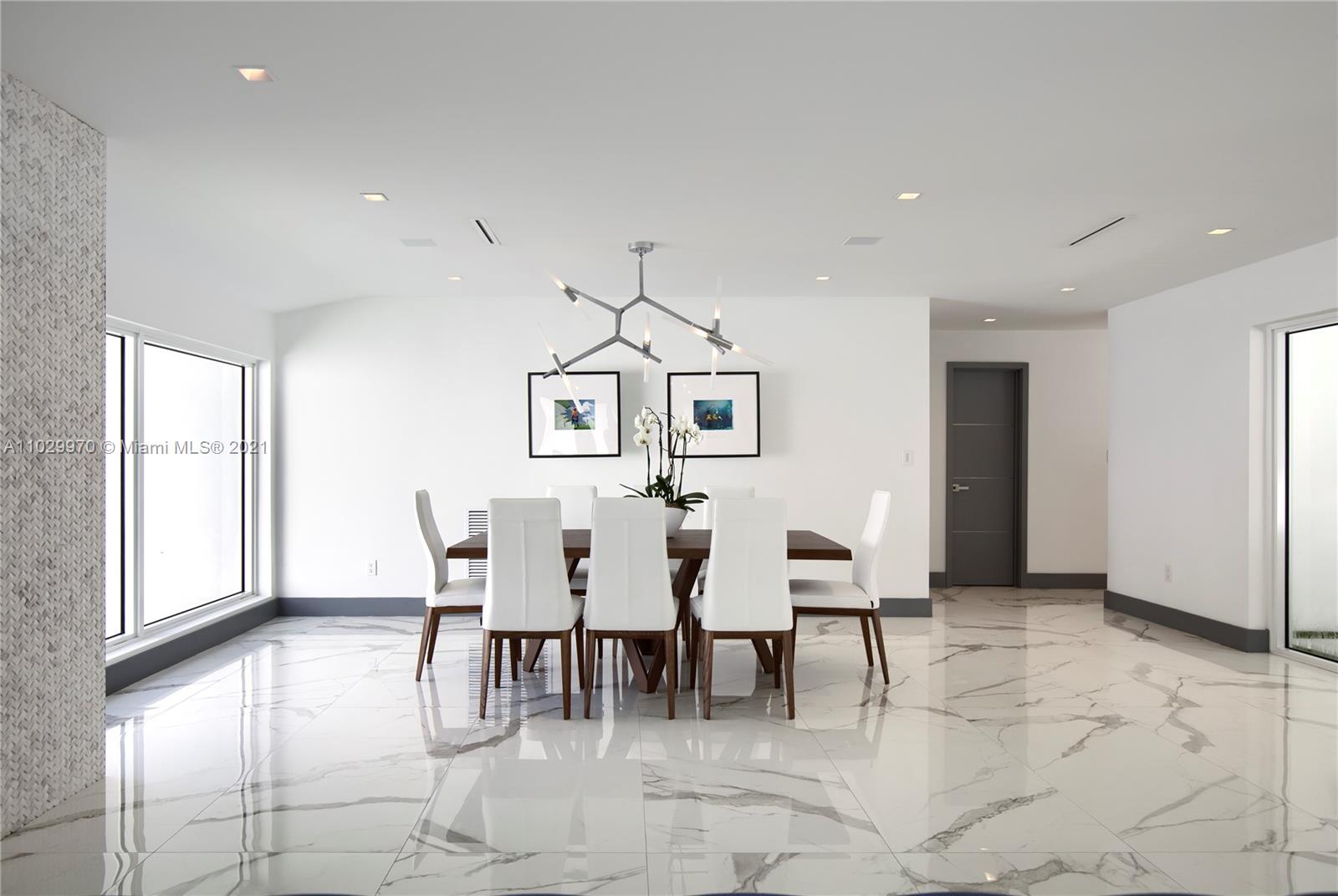 6460 Southwest 133rd Drive Pinecrest, FL 33156 - Photo 11 of 52 a dining room with furniture and wooden floor