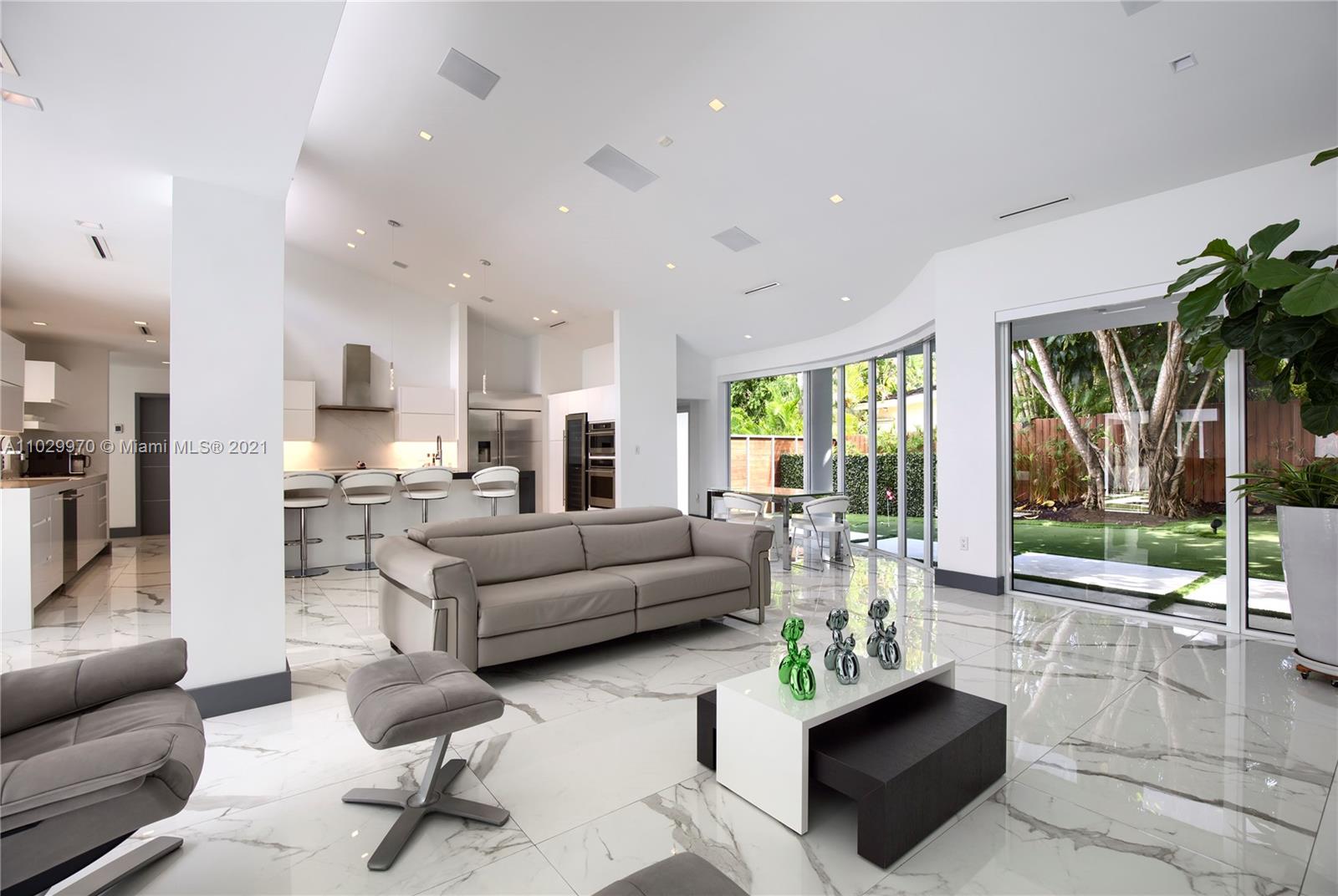 6460 Southwest 133rd Drive Pinecrest, FL 33156 - Photo 13 of 52 a living room with furniture and a large window