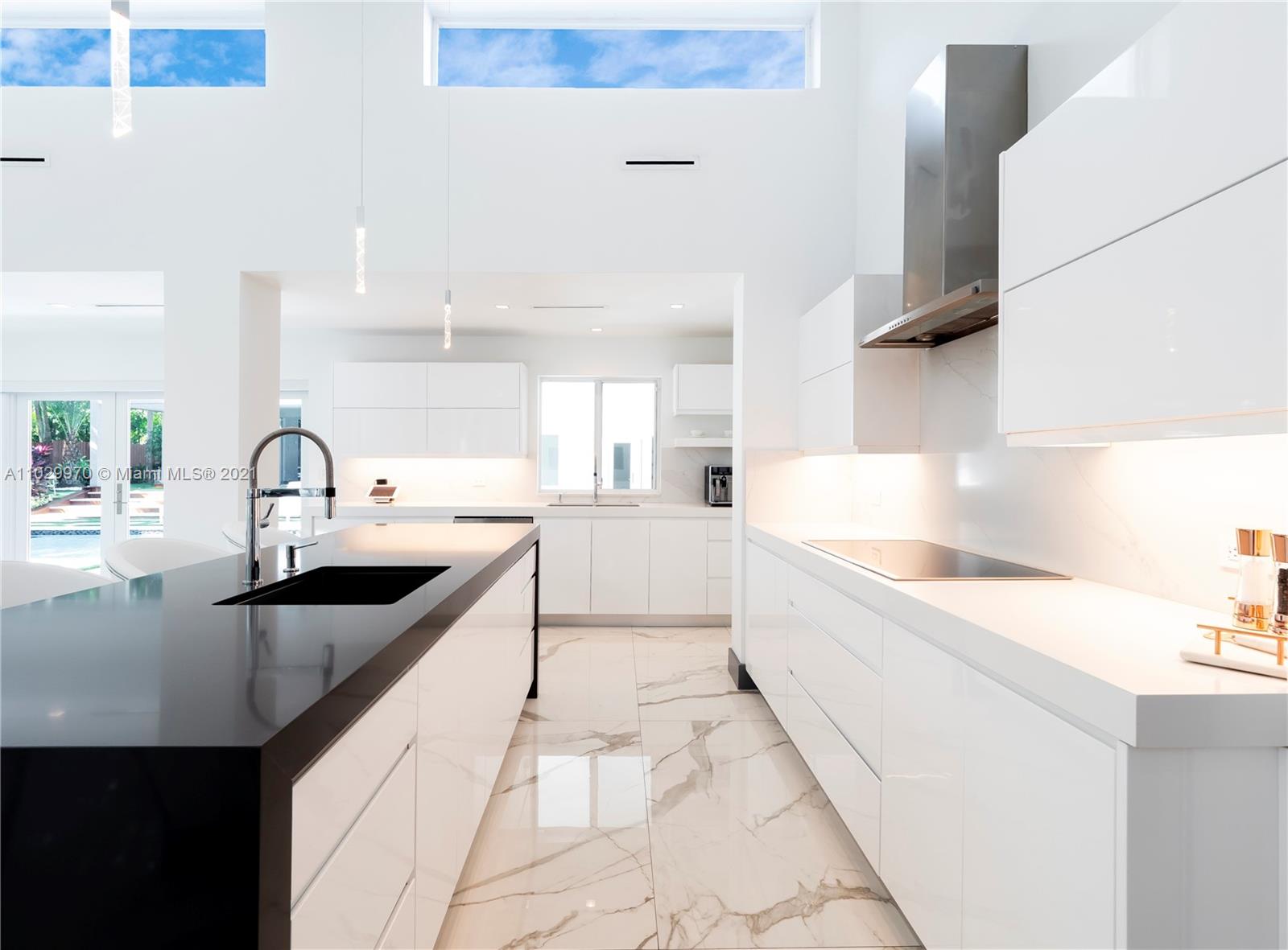 6460 Southwest 133rd Drive Pinecrest, FL 33156 - Photo 20 of 52 a large kitchen with a sink and cabinets