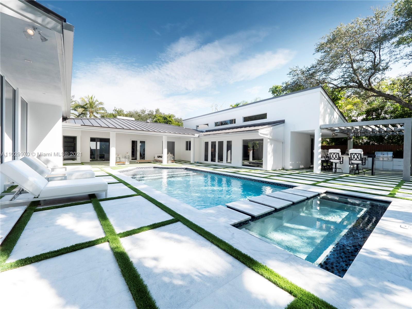 6460 Southwest 133rd Drive Pinecrest, FL 33156 - Photo 2 of 52 a view of house with swimming pool and sitting area