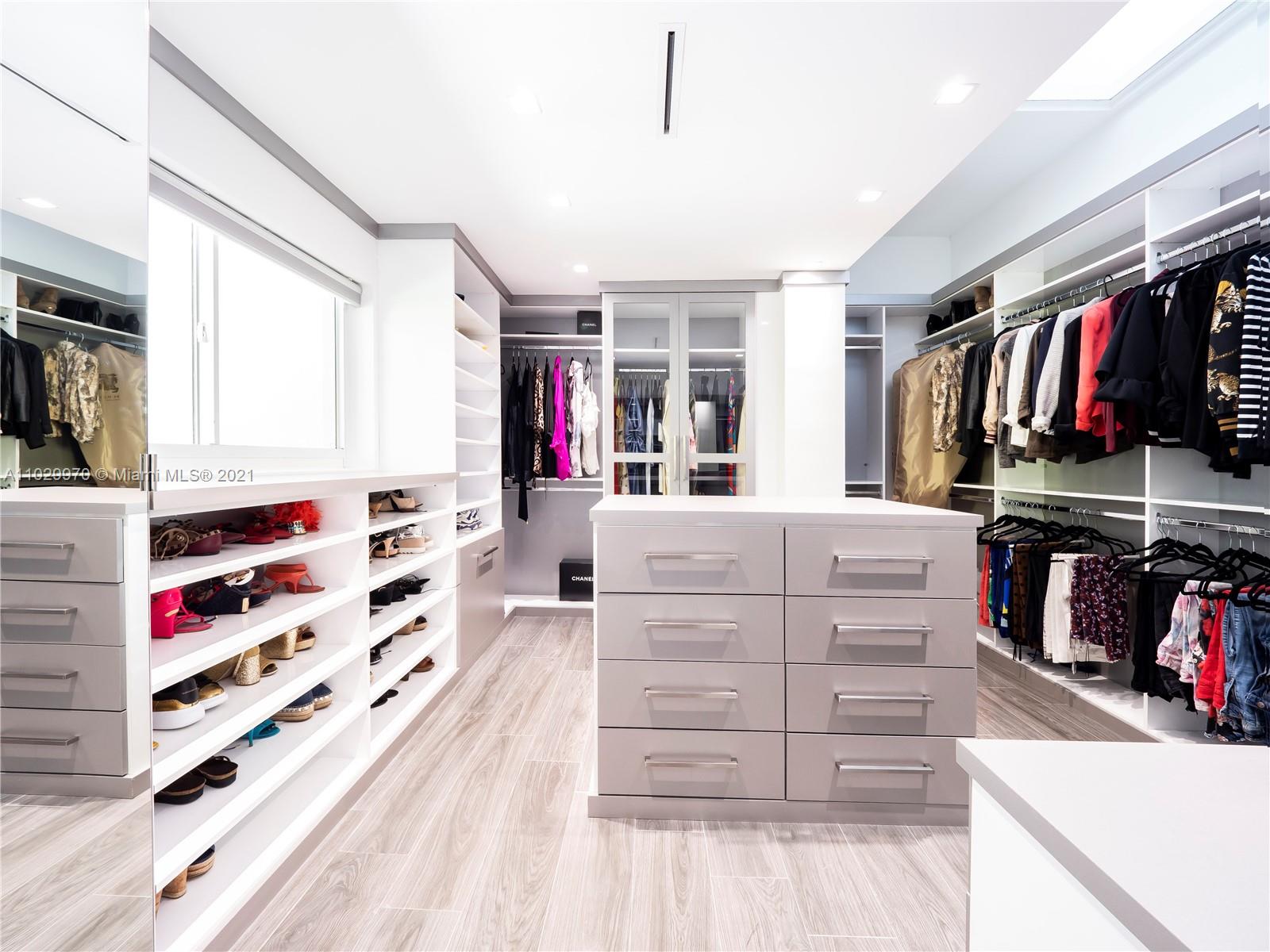 6460 Southwest 133rd Drive Pinecrest, FL 33156 - Photo 32 of 52 a view of walk in closet with clothes and shoes