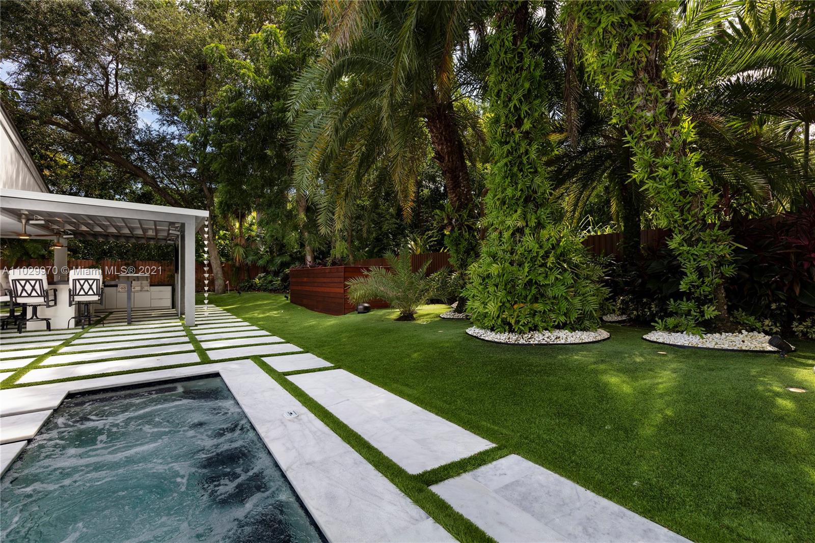 6460 Southwest 133rd Drive Pinecrest, FL 33156 - Photo 43 of 52 a view of house with backyard porch and garden