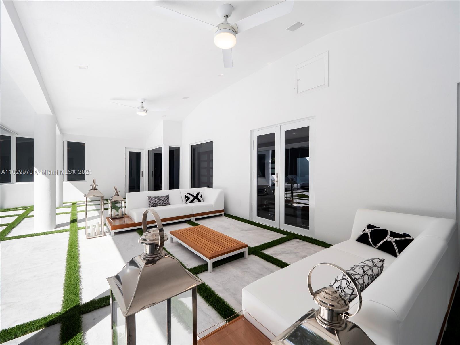 6460 Southwest 133rd Drive Pinecrest, FL 33156 - Photo 45 of 52 a living room with furniture and a window