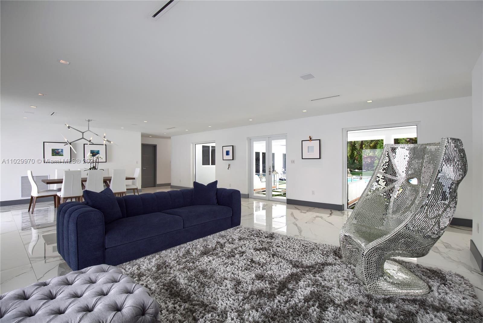 6460 Southwest 133rd Drive Pinecrest, FL 33156 - Photo 7 of 52 a living room with furniture and a wooden floor
