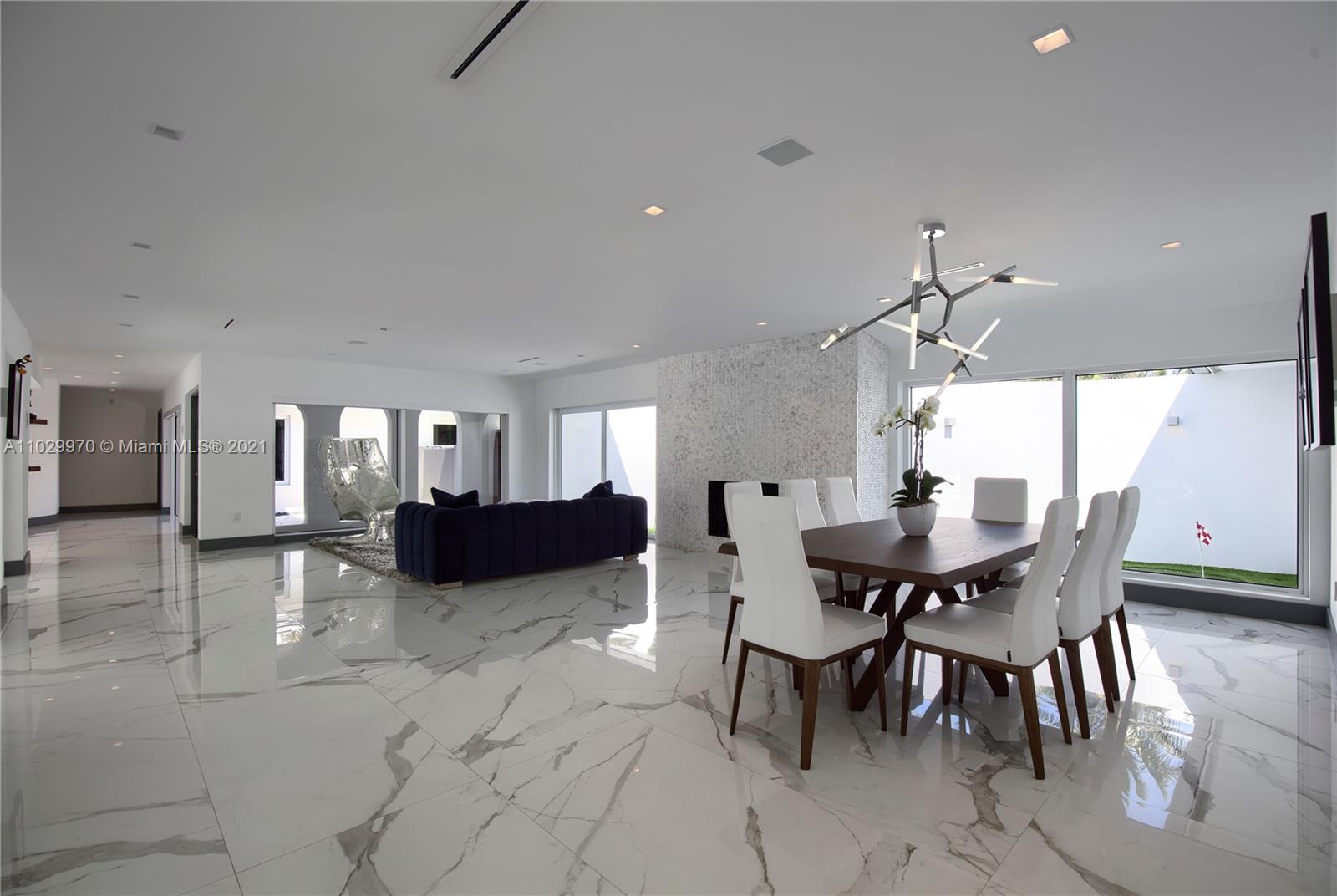 6460 Southwest 133rd Drive Pinecrest, FL 33156 - Photo 8 of 52 a view of a dining room with furniture and wooden floor