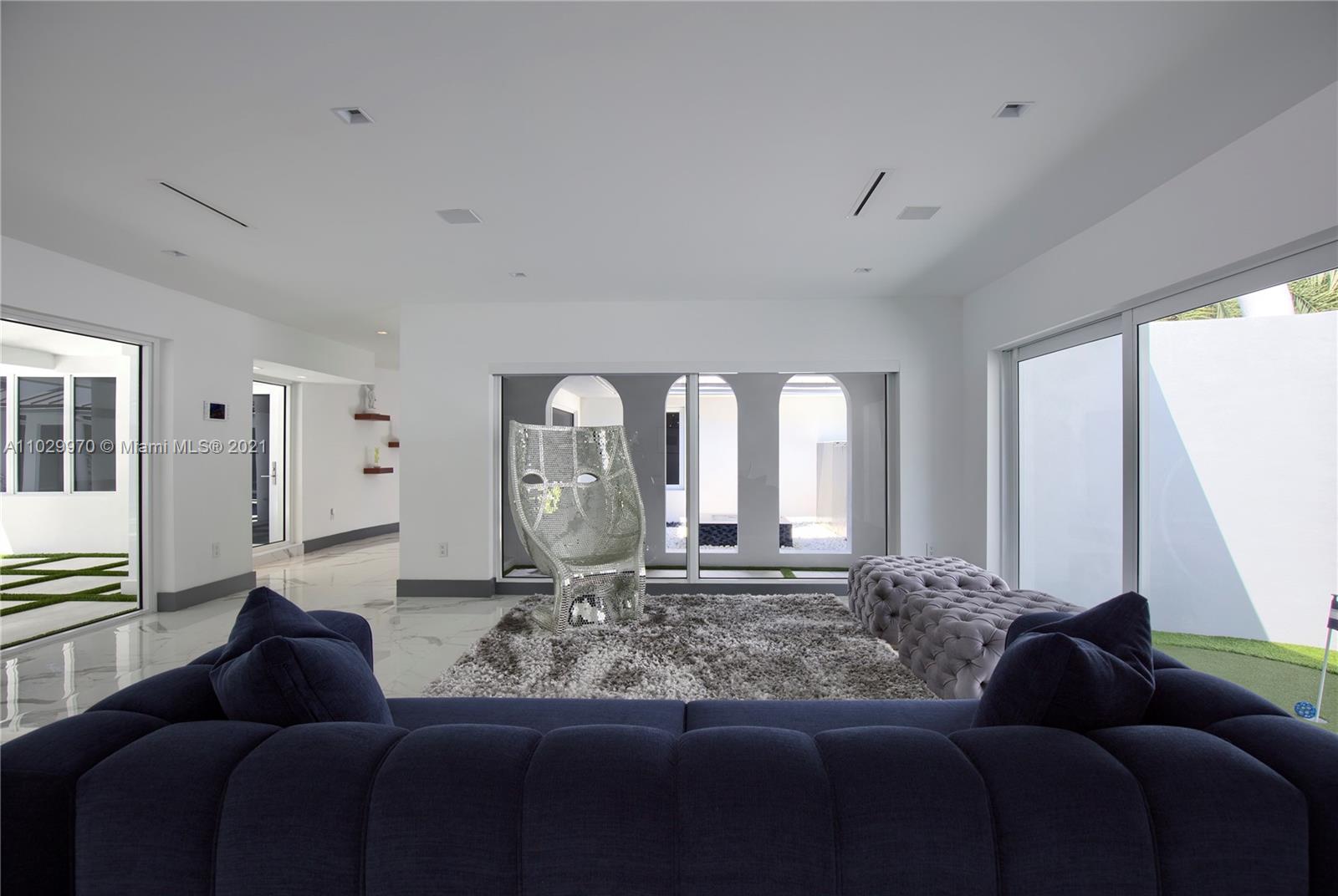 6460 Southwest 133rd Drive Pinecrest, FL 33156 - Photo 9 of 52 a living room with furniture and a large window