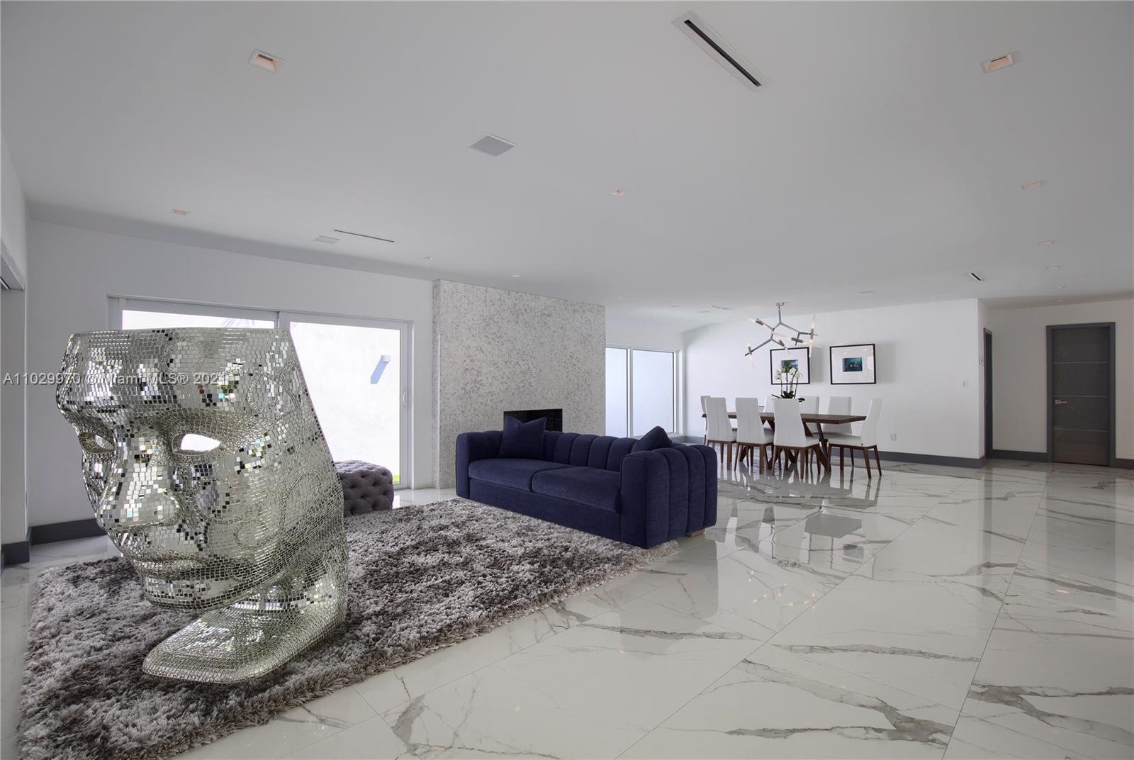 6460 Southwest 133rd Drive Pinecrest, FL 33156 - Photo 10 of 52 a living room with furniture and a table