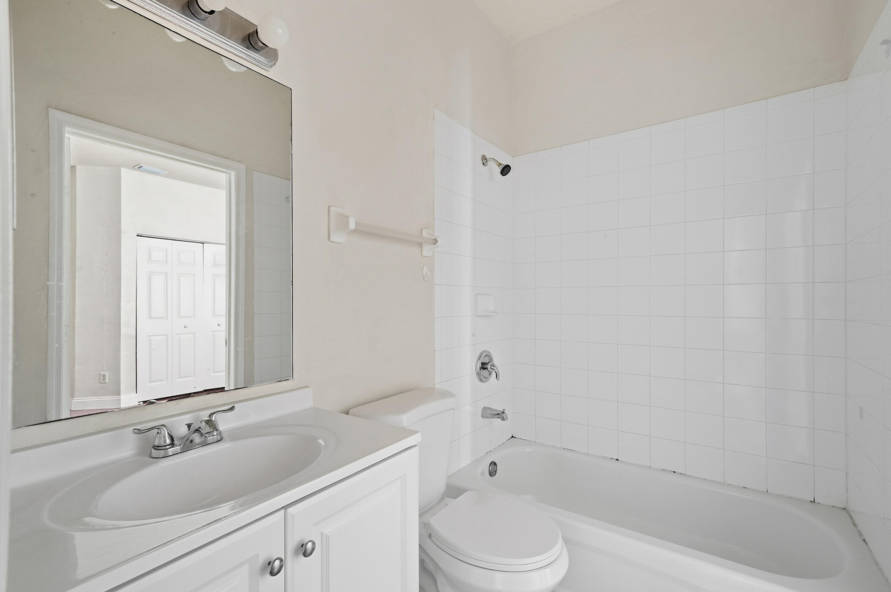 1584 Southwest 2nd Street Homestead, FL 33030 - Photo 14 of 28 a bathroom with a bathtub shower sink vanity mirror and toilet