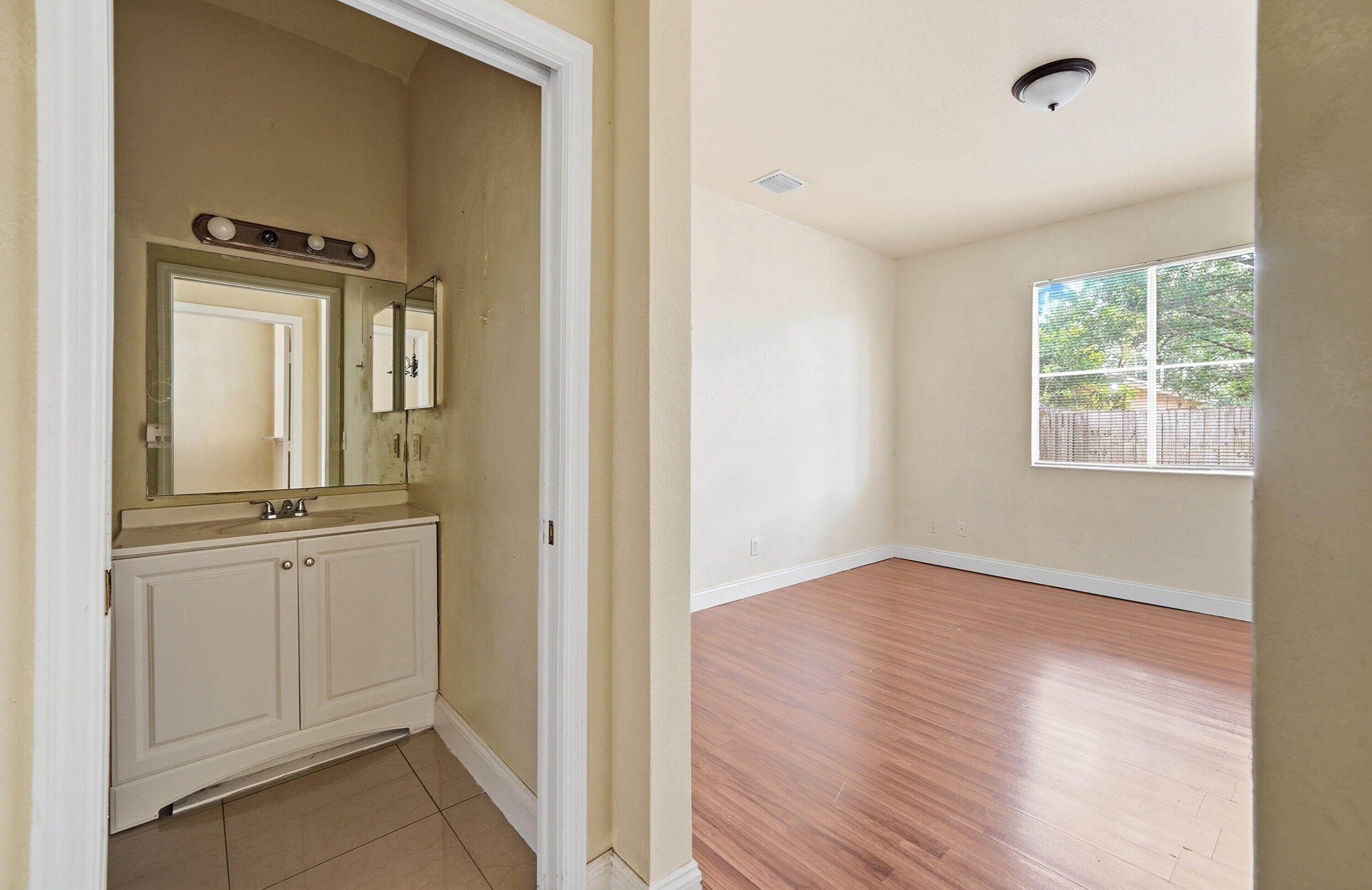 1584 Southwest 2nd Street Homestead, FL 33030 - Photo 17 of 28 a view of a bathroom with sink mirror and window
