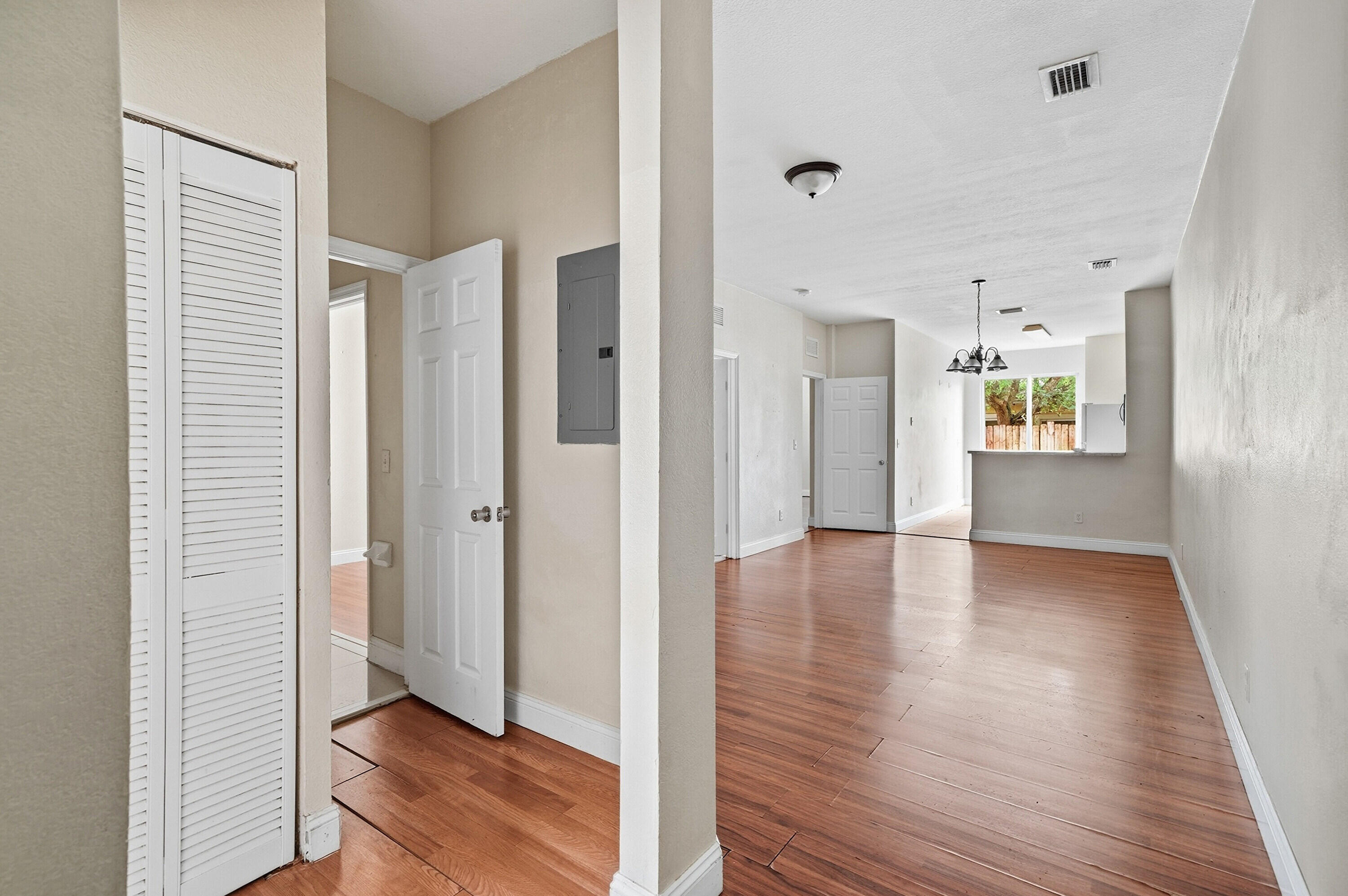1584 Southwest 2nd Street Homestead, FL 33030 - Photo 5 of 28 a view of a hallway with wooden floor and closet area