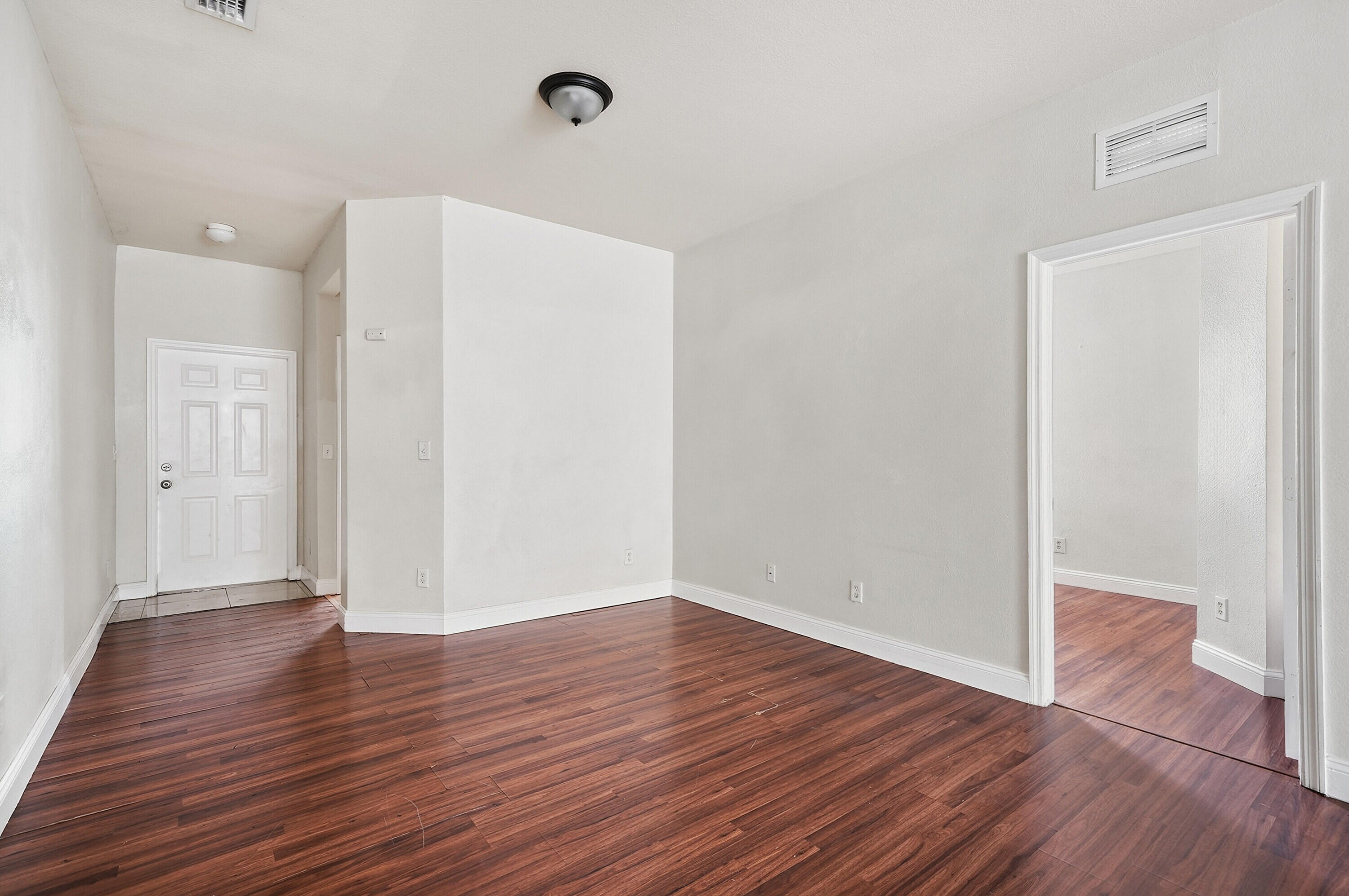 1584 Southwest 2nd Street Homestead, FL 33030 - Photo 10 of 28 a view of an empty room with wooden floor