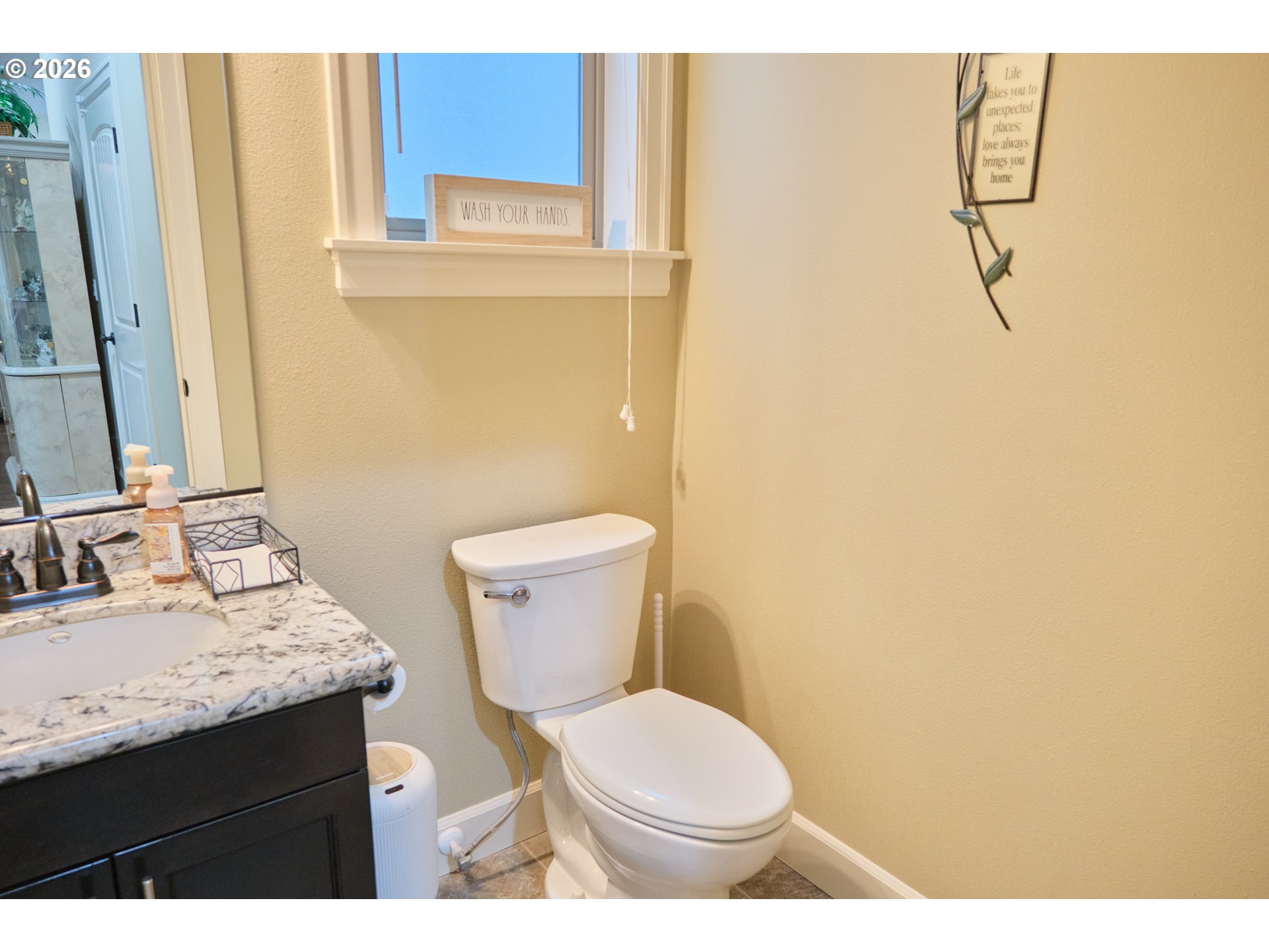 1168 Taurus Loop Northeast Keizer, OR 97303 - Photo 11 of 30 a bathroom with a granite countertop toilet and a sink