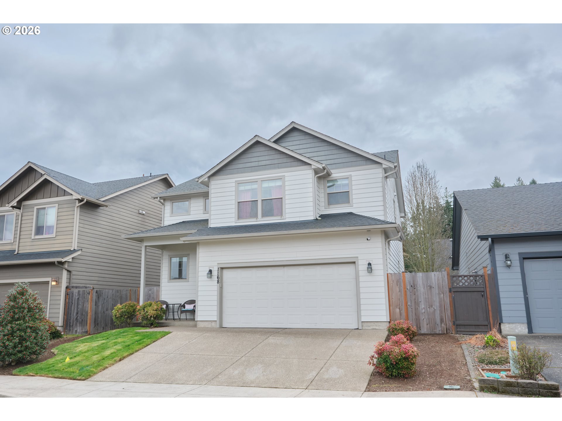1168 Taurus Loop Northeast Keizer, OR 97303 - Photo 2 of 30 a view of a house with a yard and garage