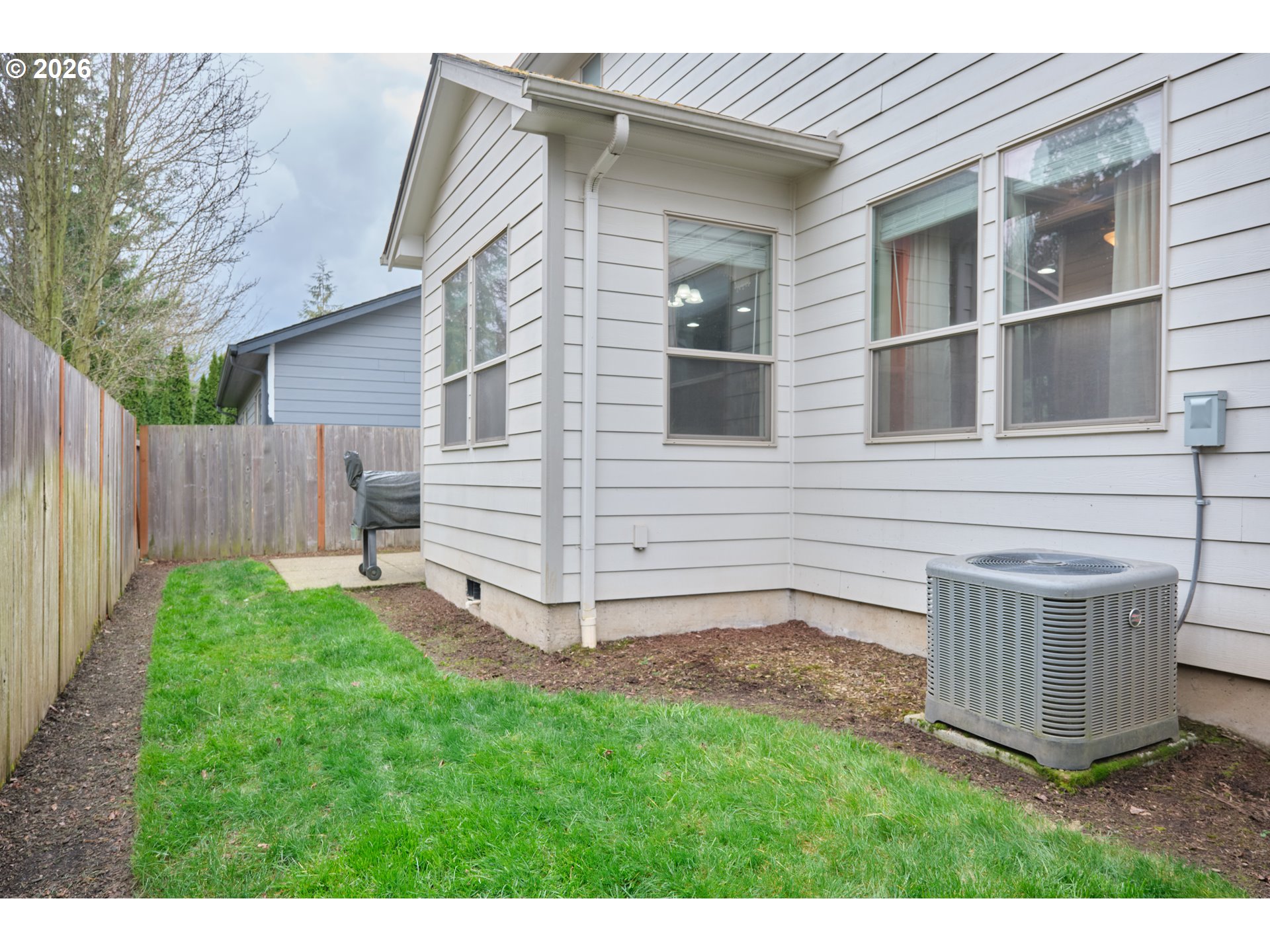 1168 Taurus Loop Northeast Keizer, OR 97303 - Photo 25 of 30 a view of backyard with barbeque grill and wooden fence