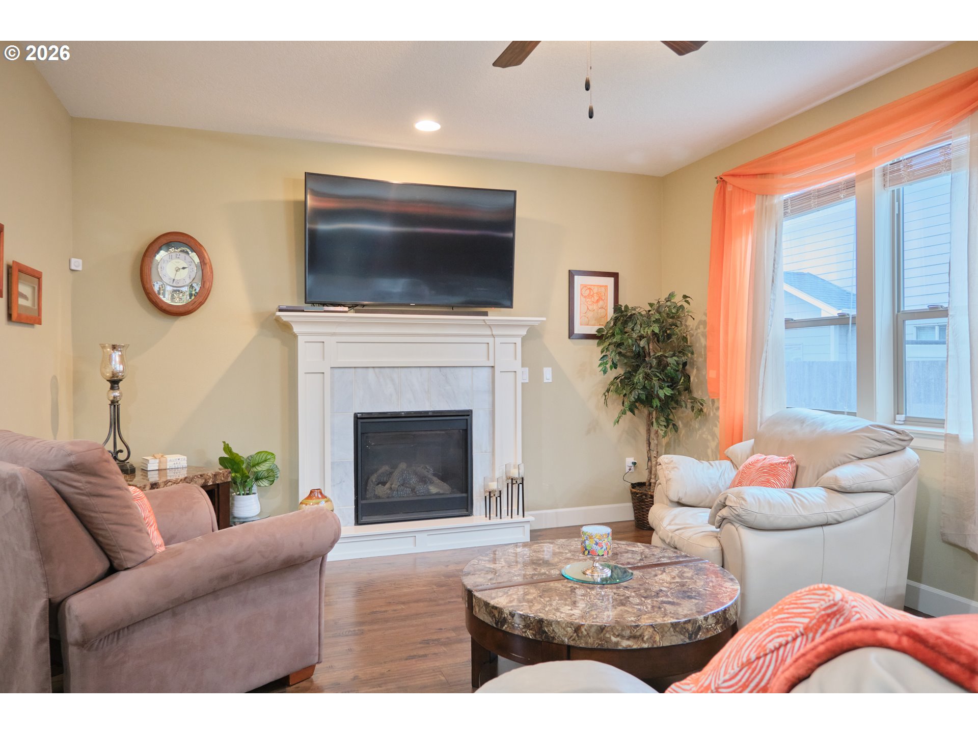 1168 Taurus Loop Northeast Keizer, OR 97303 - Photo 5 of 30 a living room with furniture a flat screen tv and a fireplace
