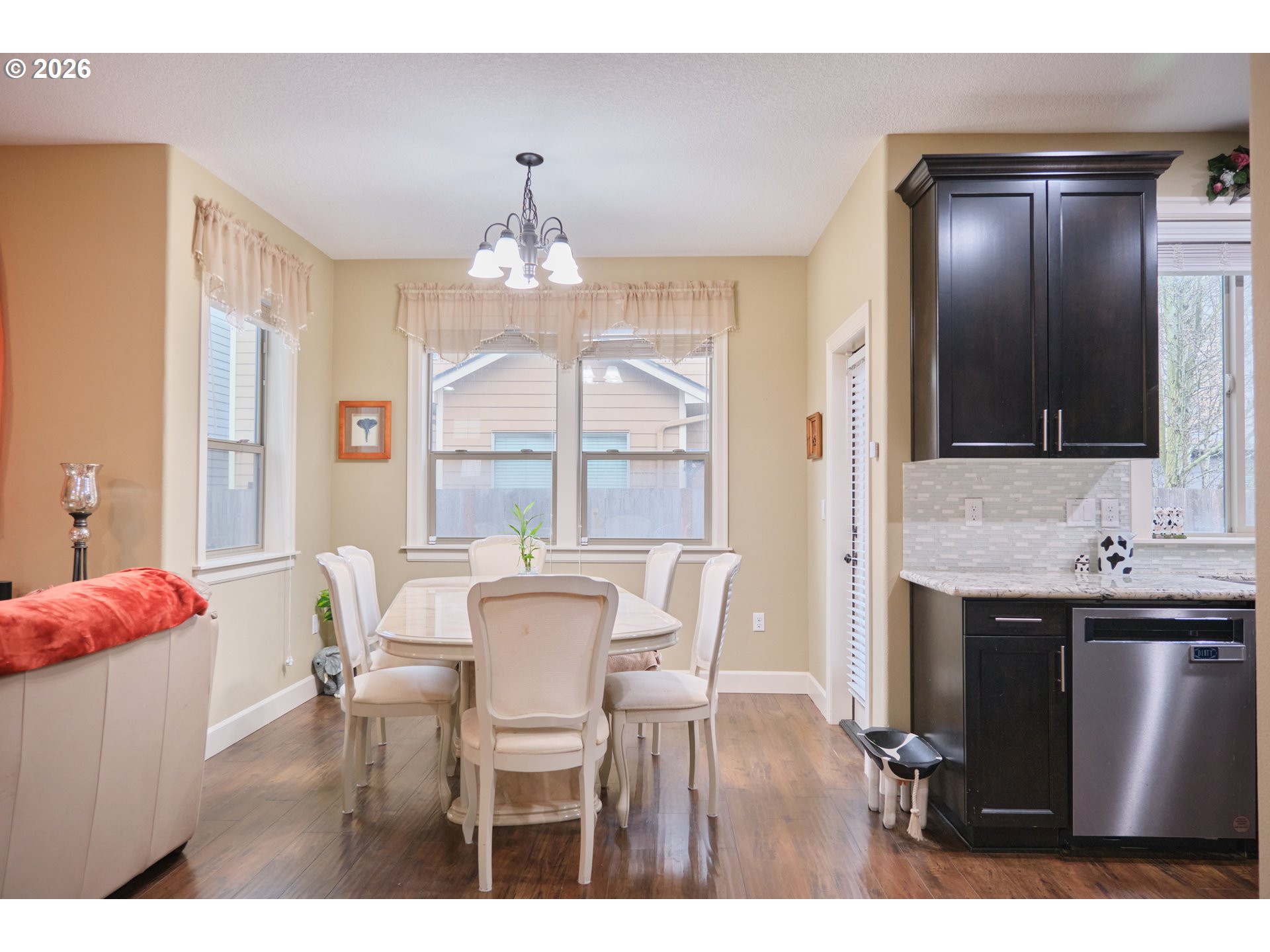 1168 Taurus Loop Northeast Keizer, OR 97303 - Photo 6 of 30 a view of a dining room with furniture and chandelier