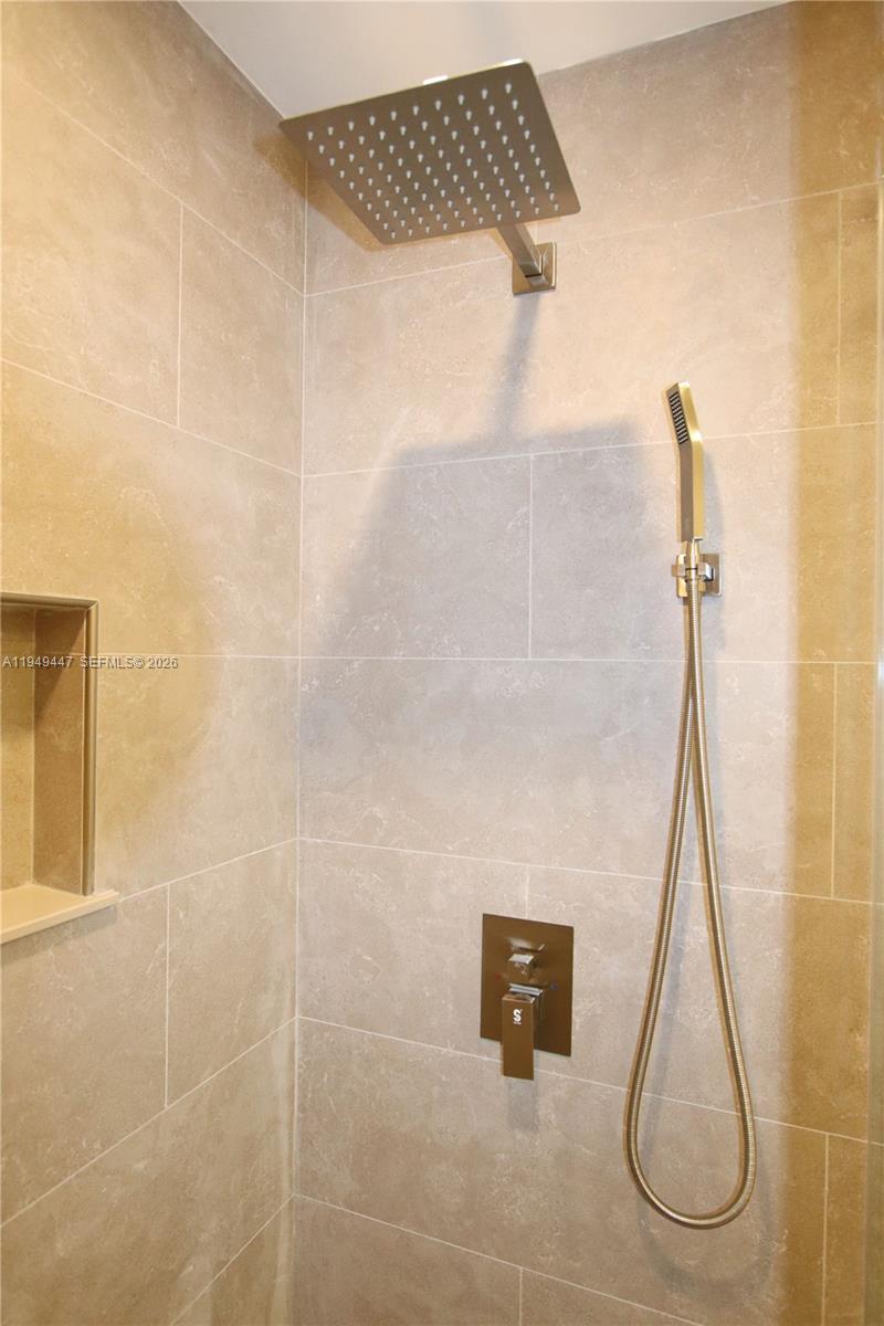 10681 Southwest 156th Place, Unit 402 Miami, FL 33196 - Photo 17 of 36 a bathroom with a shower