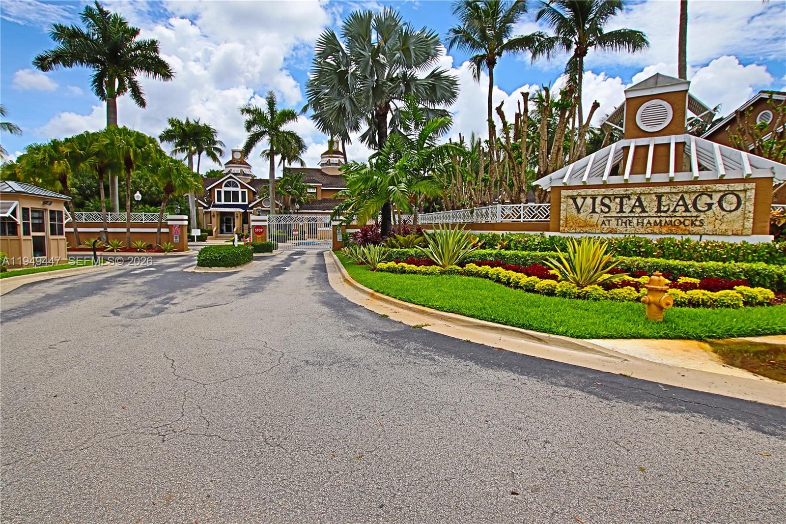10681 Southwest 156th Place, Unit 402 Miami, FL 33196 - Photo 2 of 36 a street sign on a wall next to a road