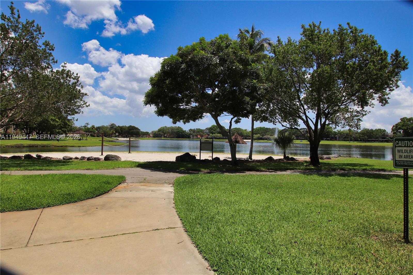 10681 Southwest 156th Place, Unit 402 Miami, FL 33196 - Photo 30 of 36 a view of a park with large trees