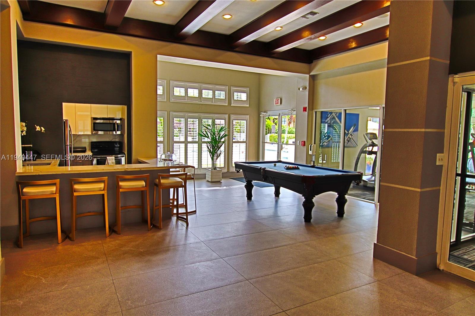 10681 Southwest 156th Place, Unit 402 Miami, FL 33196 - Photo 32 of 36 a very nice looking dining room with a large dining table and chairs