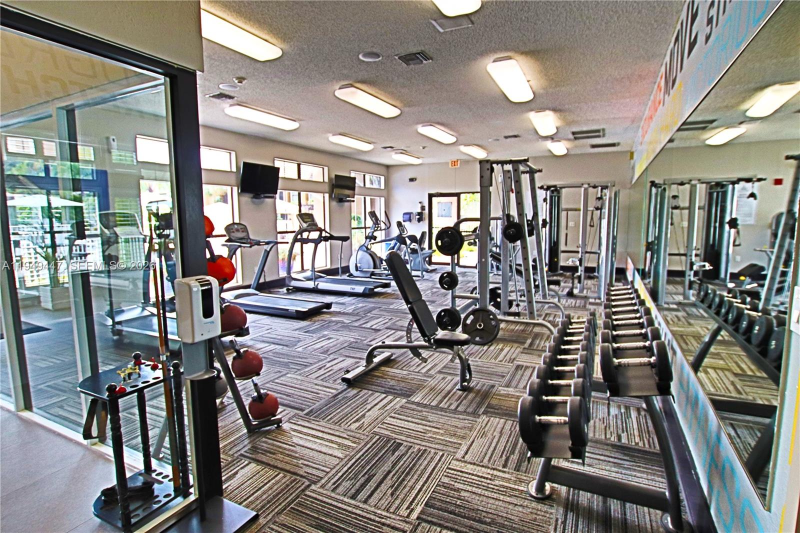 10681 Southwest 156th Place, Unit 402 Miami, FL 33196 - Photo 34 of 36 a view of a room with gym equipment