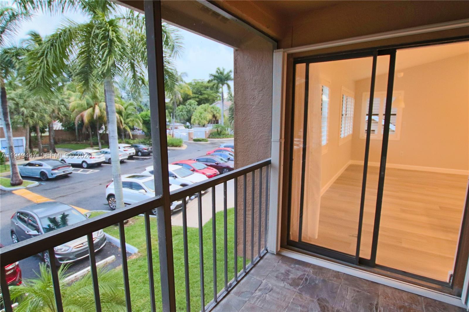 10681 Southwest 156th Place, Unit 402 Miami, FL 33196 - Photo 8 of 36 a view of a balcony with yard