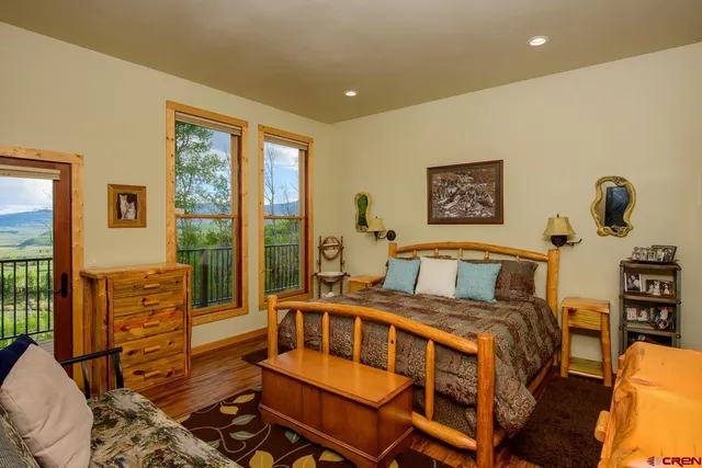 a bedroom with furniture and a window