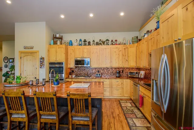 a dining table with chairs and chandelier