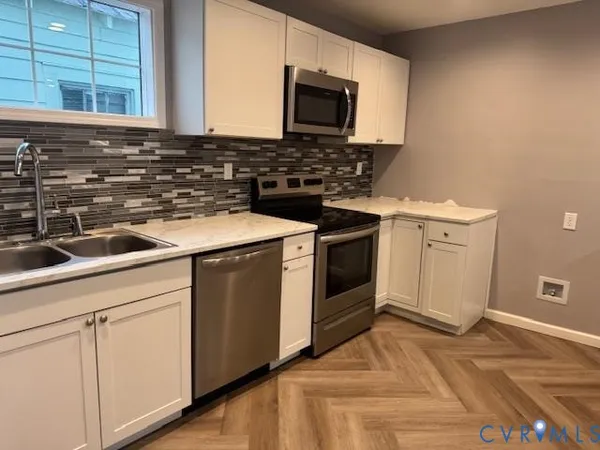 a kitchen with a stove and a microwave